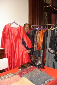 Lisa Derrick, daughter of fashion designer Grace Derrick, holds a seasonal evening gown ready for a New Years Eve party.