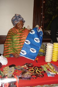 Monique Brede who sold dresses, table mats and jewerly holds cotton fabric from Africa that she sold by the yard.