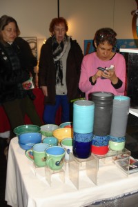Lynn Goodman writes up an order for her ceramics.